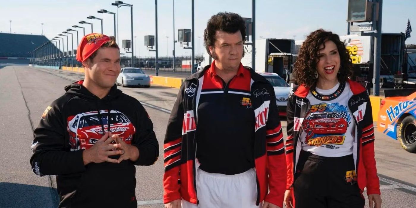 Kelvin (Adam DeVine), Jesse (Danny McBride), and Judy (Edi Patterson) smiling on the racetrack in The Righteous Gemstones Season 3 Episode 1