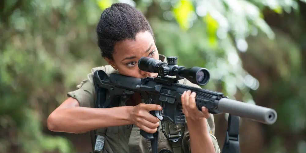 Sasha Williams aims down the scope of her sniper rifle in 'The Walking Dead'
