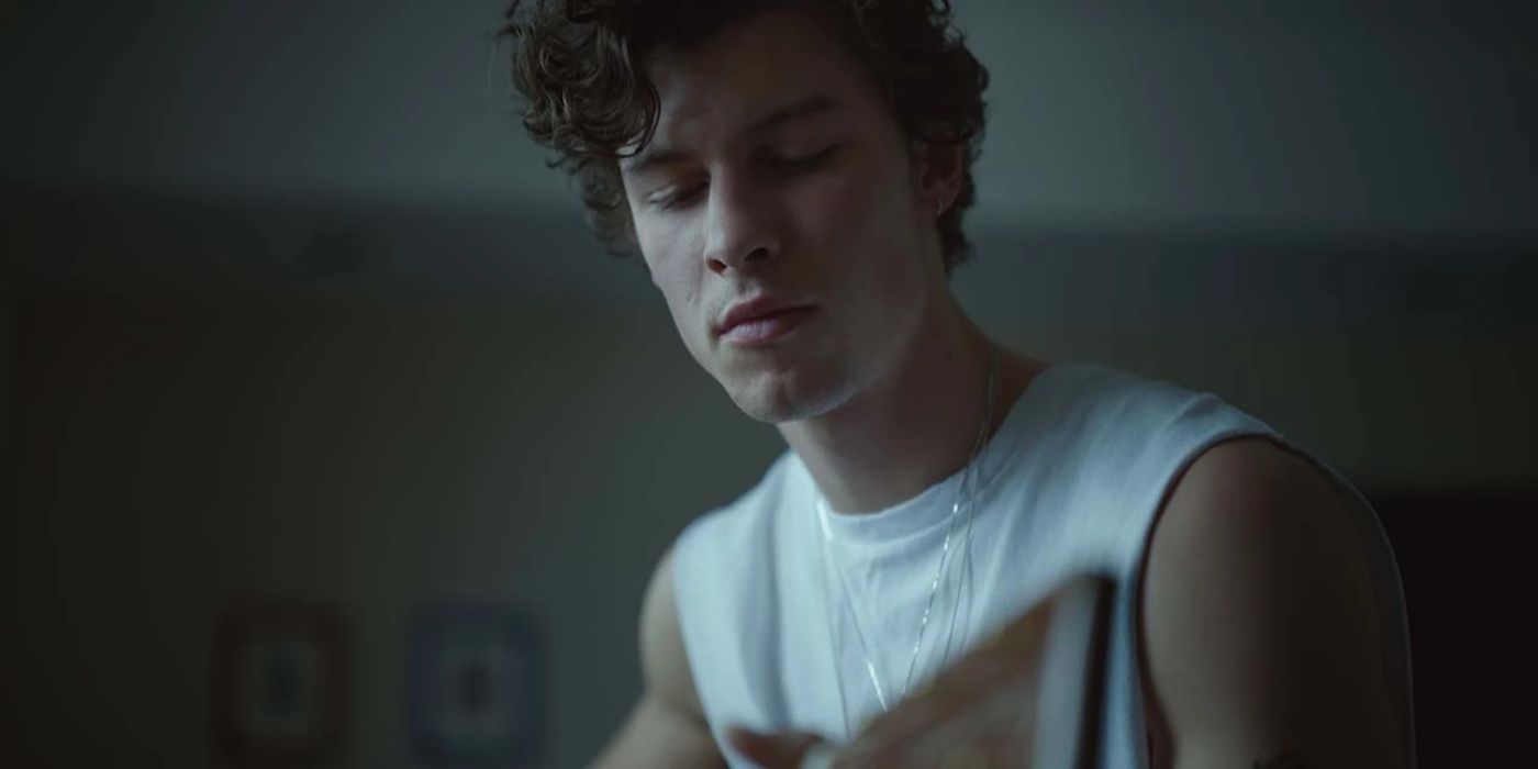 Shawn Mendes looking down at his guitar in the Netflix Documentary Wonder.