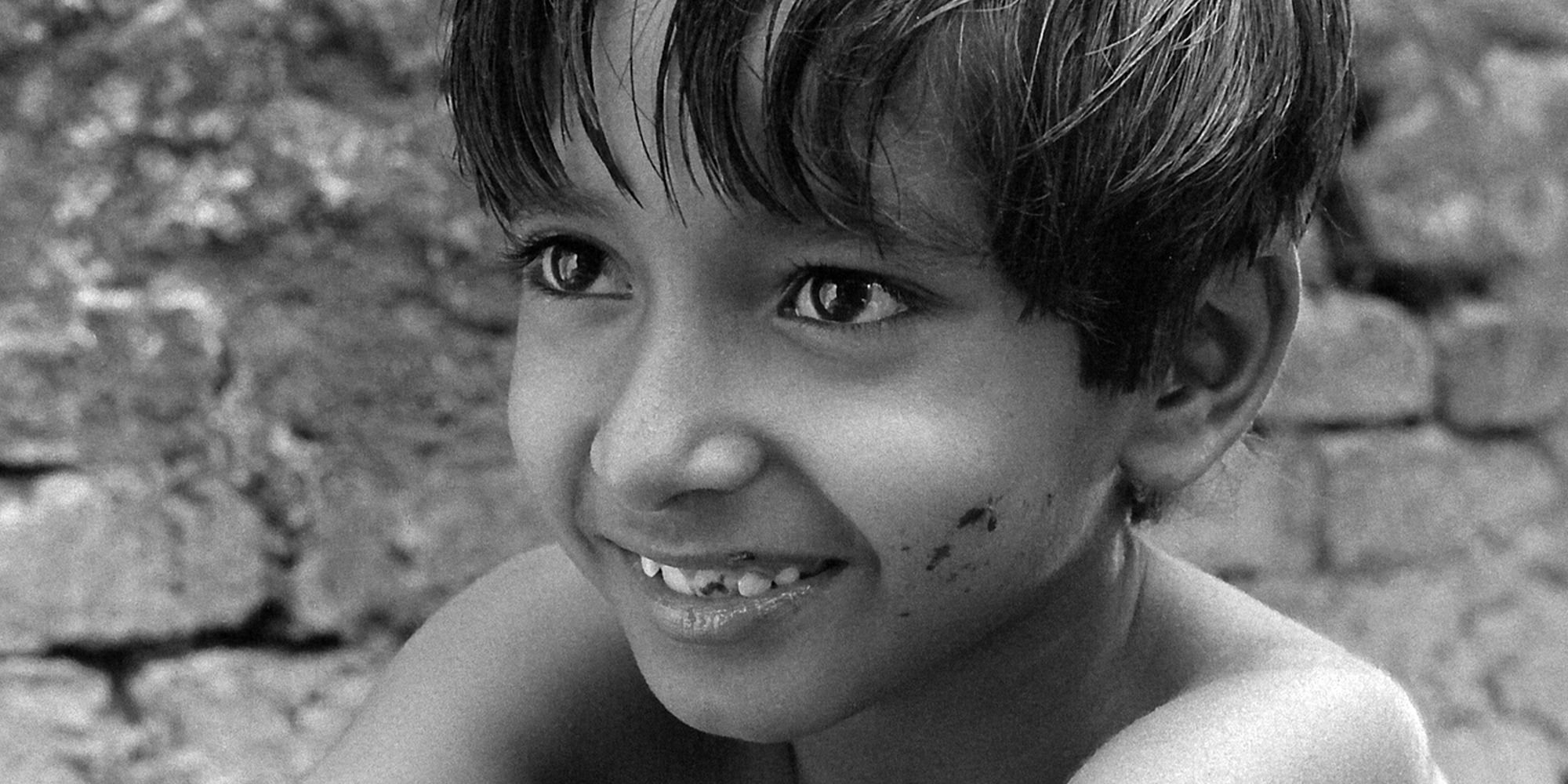 Subir Banerjee as Apu looking over the camera in 'Pather Panchali'.