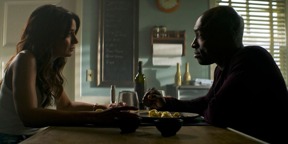 Lana (Emmanuelle Chriqui) and John Henry (Wolé Parks) eating together