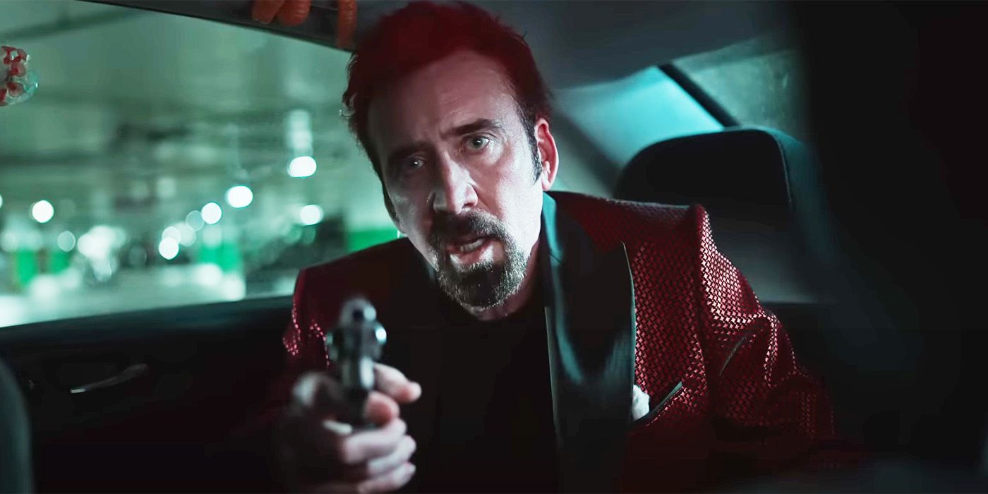 Nicolas Cage holds a gun in Sympathy for the Devil