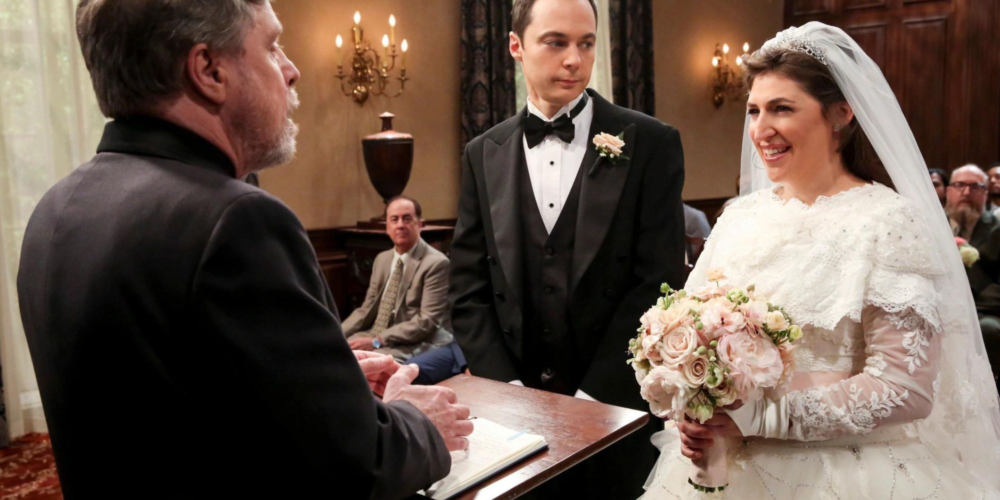 Jim Parsons and Mayim Bialik as Sheldon and Amy getting married by Mark Hamill in The Big Bang Theory.