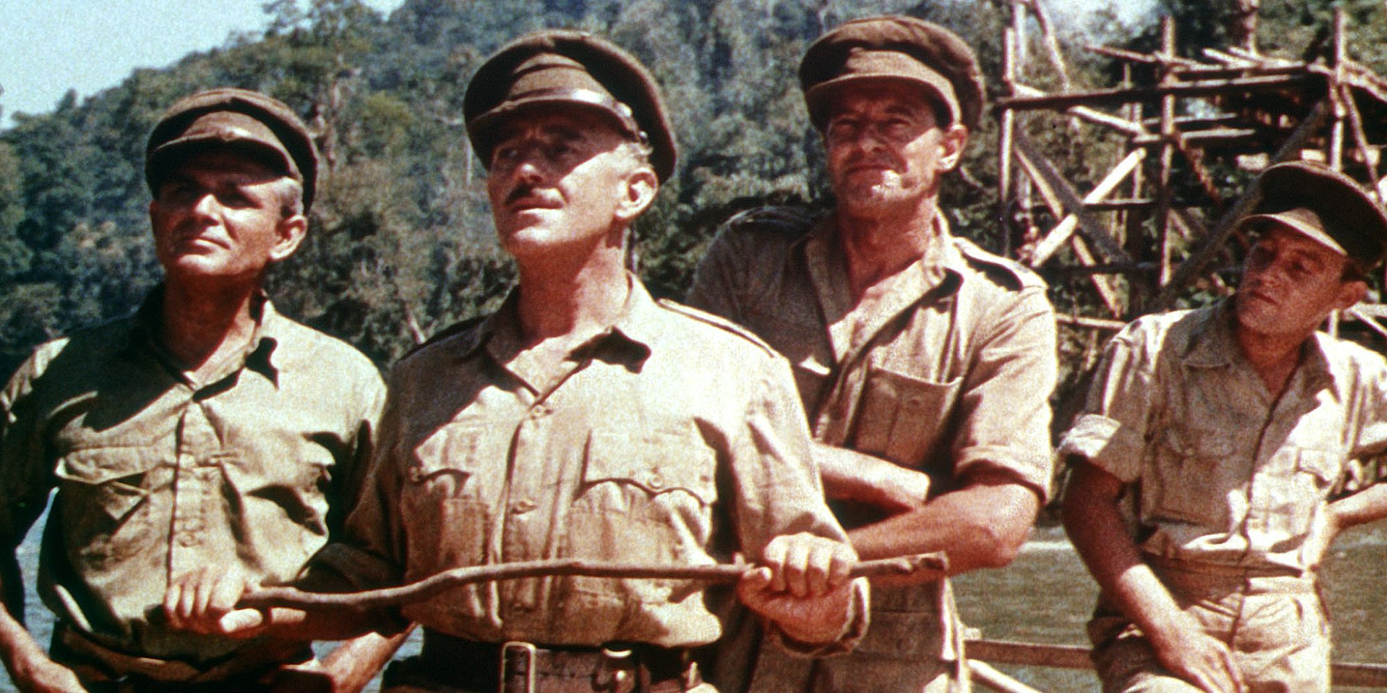 Lead characters of The Bridge on the River Kwai looking upward in the daylight