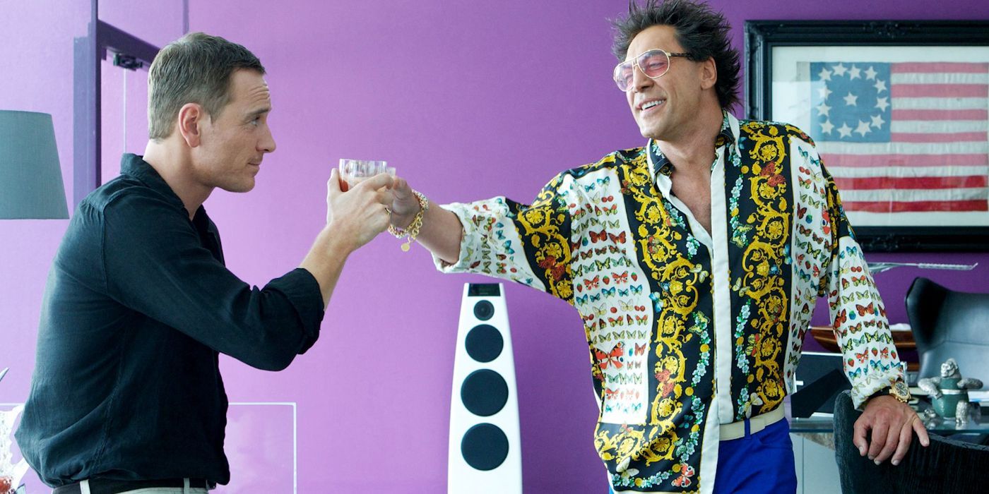 Michael Fassbender and Javier Bardem share a toast in The Counselor