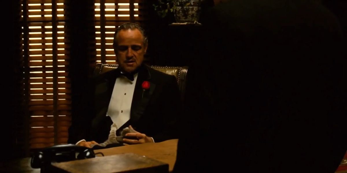 Marlon Brando as Vito Corleone and a happy cat in Francis Ford Coppola's The Godfather