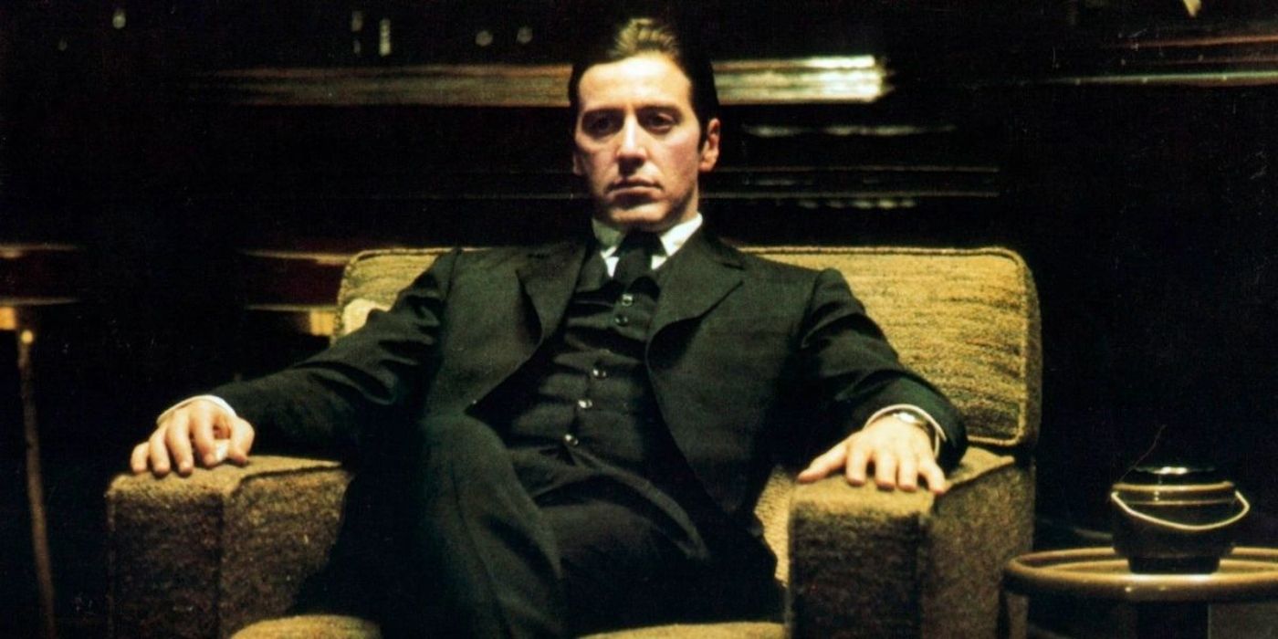 Al Pacino as Michael Corleone sitting on a chair with his legs crossed in The Godfather Part II