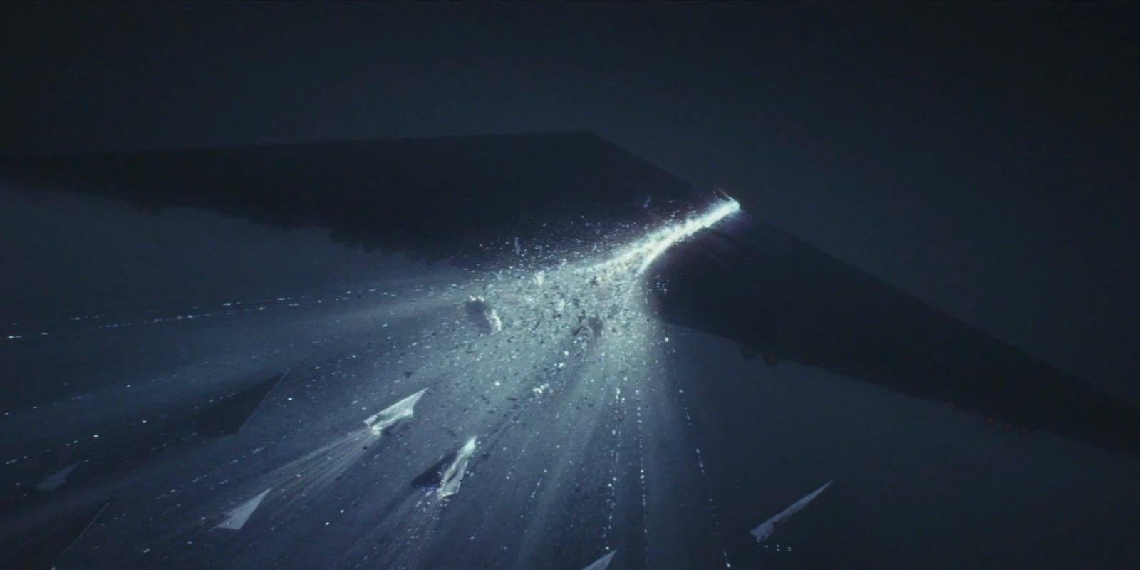 A spaceship is torn apart as a rival ship blasts through it at light speed.