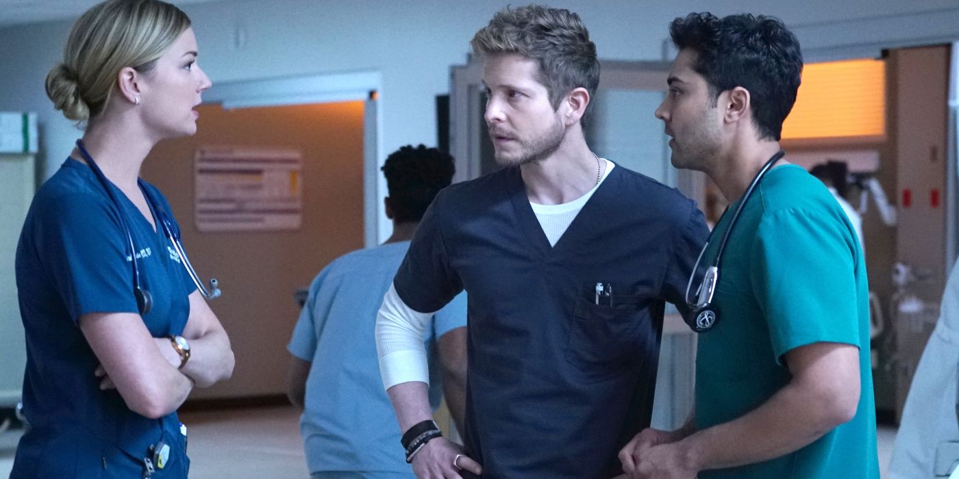 Matt Czuchry as Conrad Hawkins talking to Emily VanCamp as Nicolette Nevin and Manish Dayal as Devon Pravash in a hospital as doctors in The Resident