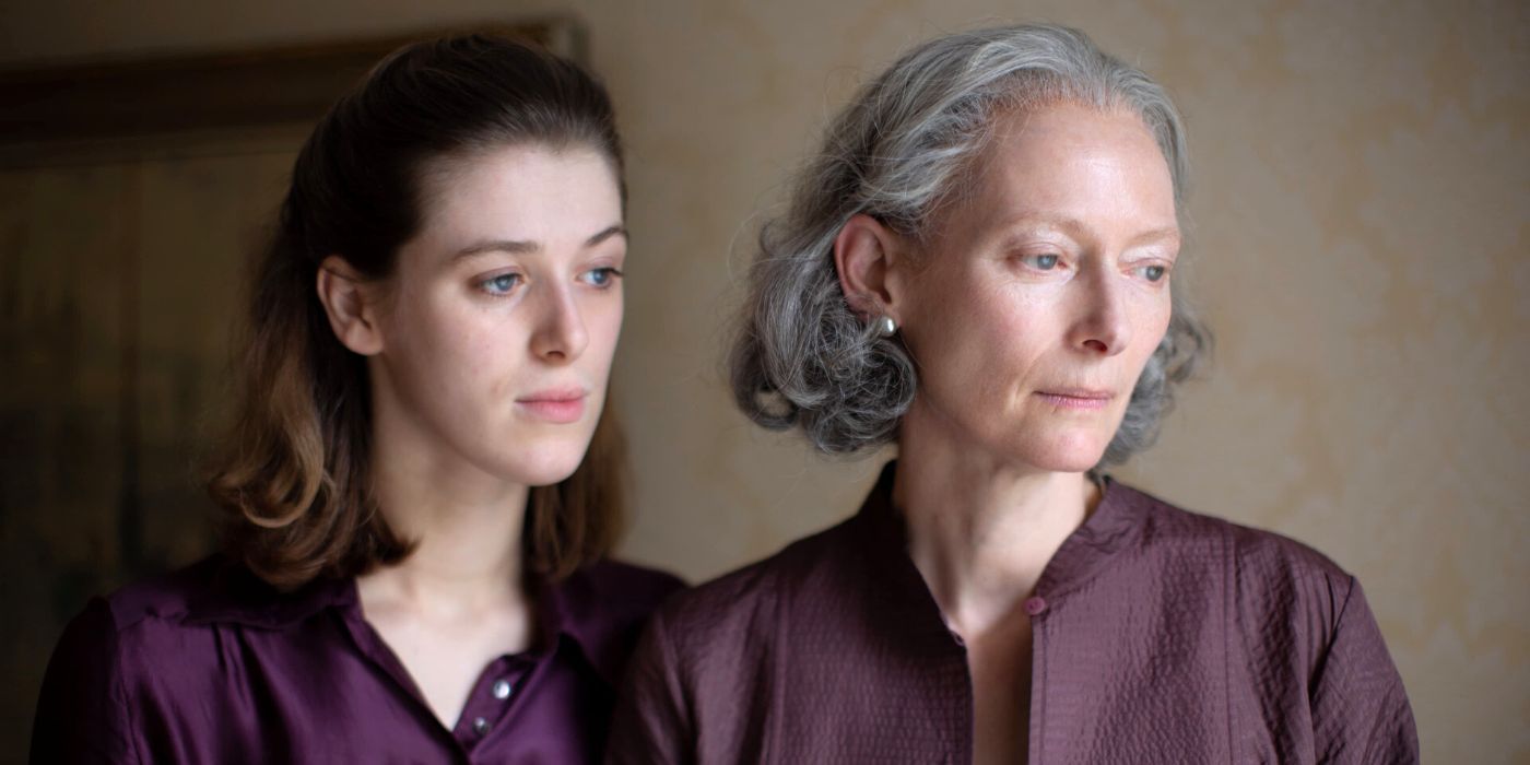 Tilda Swinton and Honor Swinton Bryne standing next to each other looking out a window in The Souvenir:Part II