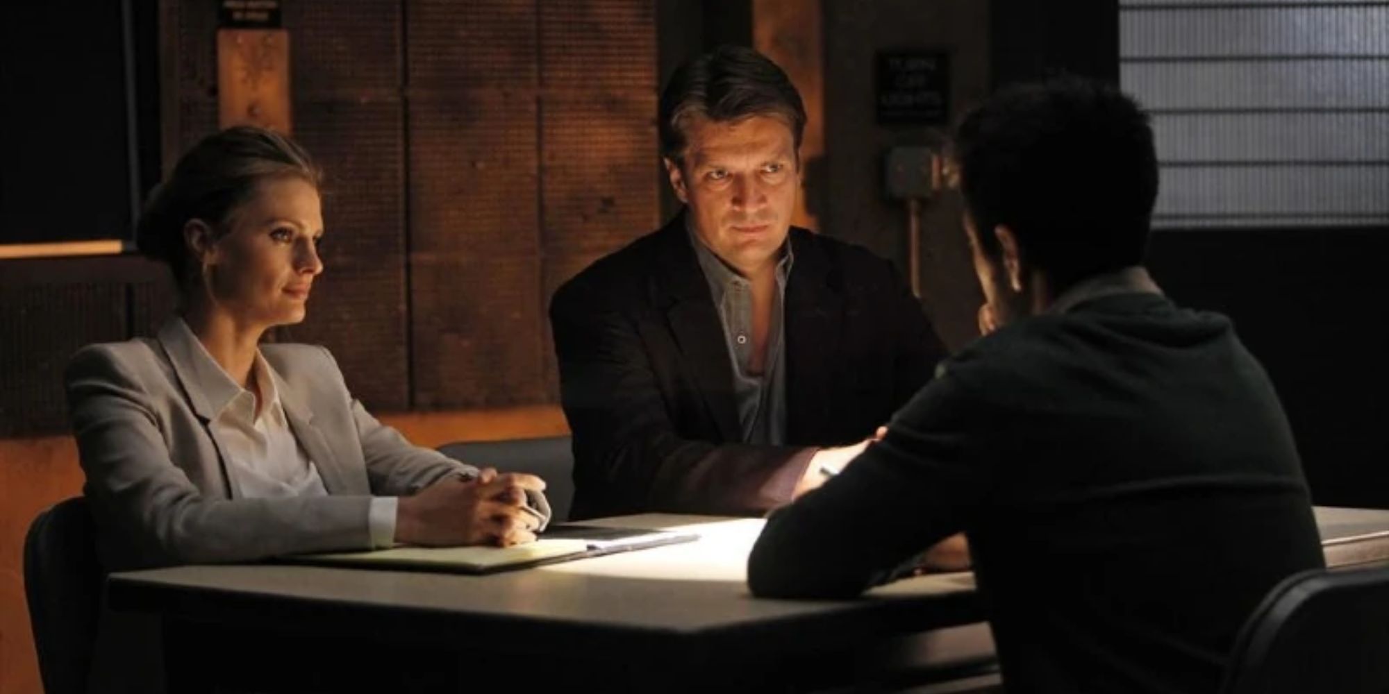 Castle and Beckett question a suspect 