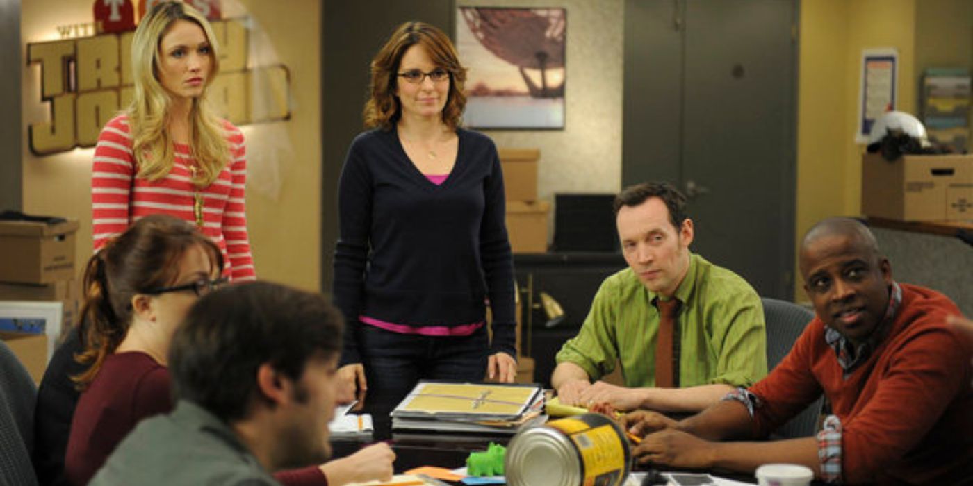 Tina Fey as Liz Lemmon with her staff writers in 30 Rock