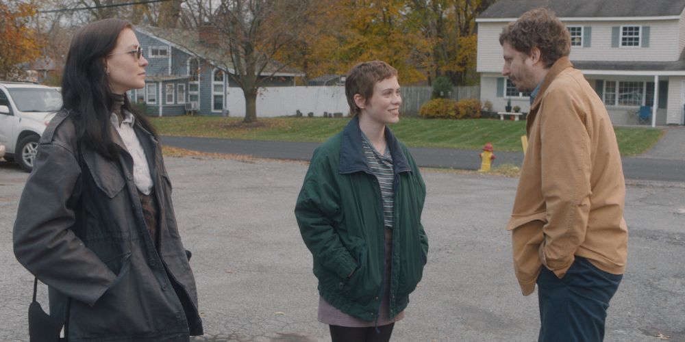 Hannah Gross, Sophia Lillis, and Michael Cera standing outside in The Adults