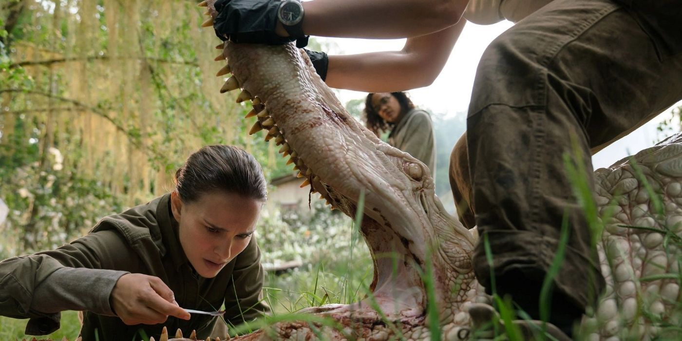 Lena checking the inside of an alligator's mouth in 'Annihilation'