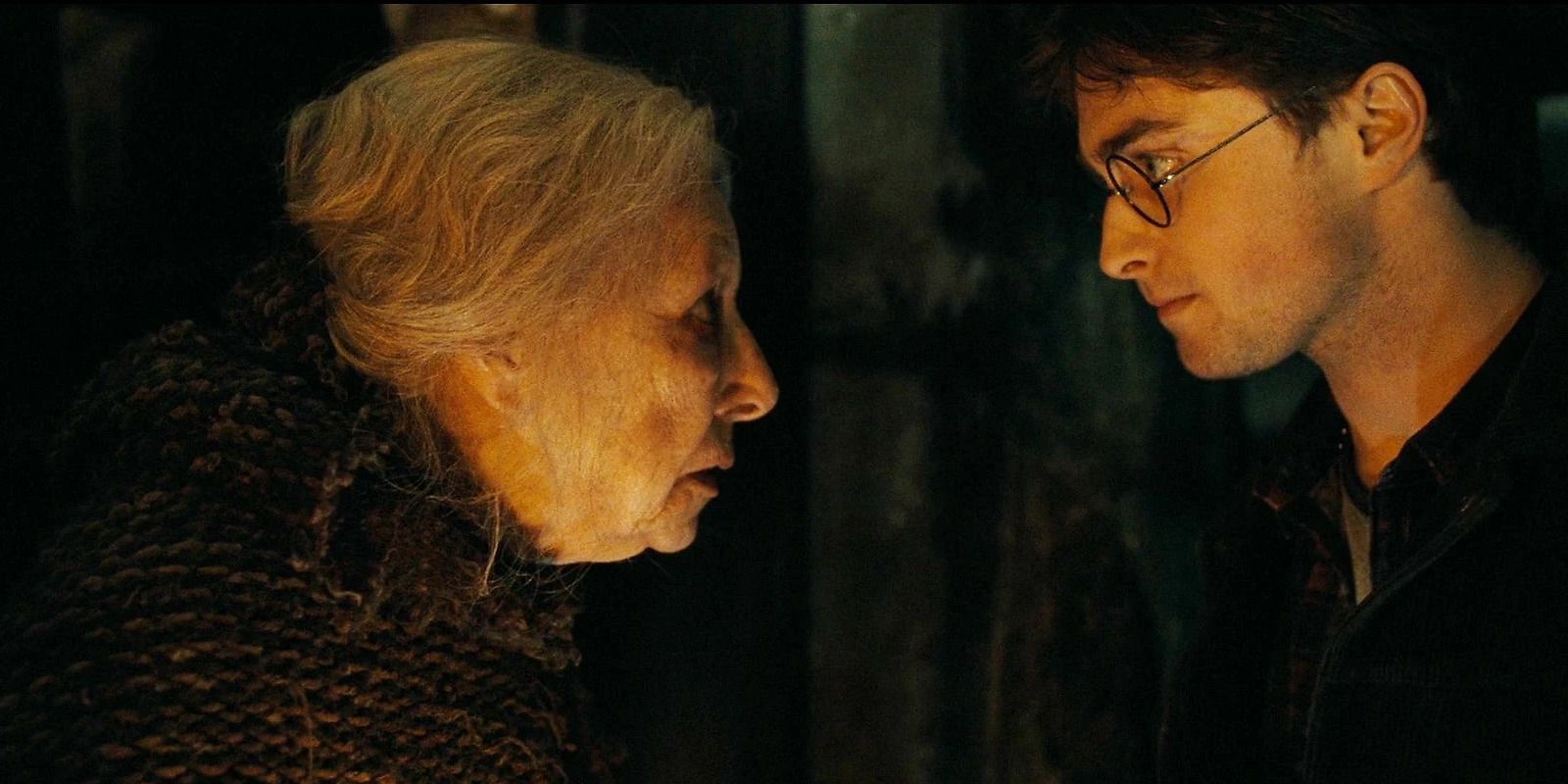 Bathilda Bagshot (Hazel Douglas) and Harry Potter (Daniel Radcliffe) in a dark room in Deathly Hallows Part 1