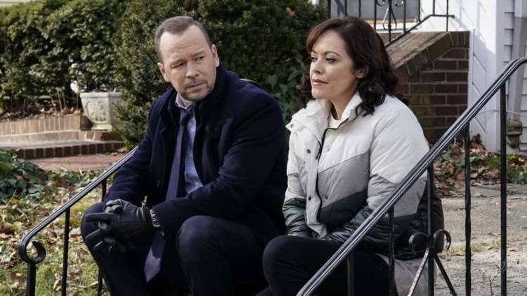 Donnie Wahlberg and Marissa Ramirez as Danny Reagan and Maria Baez sitting on a stoop