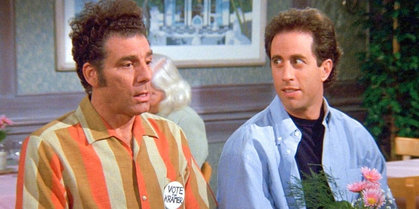 Kramer et Jerry assis à une table, Kramer parle