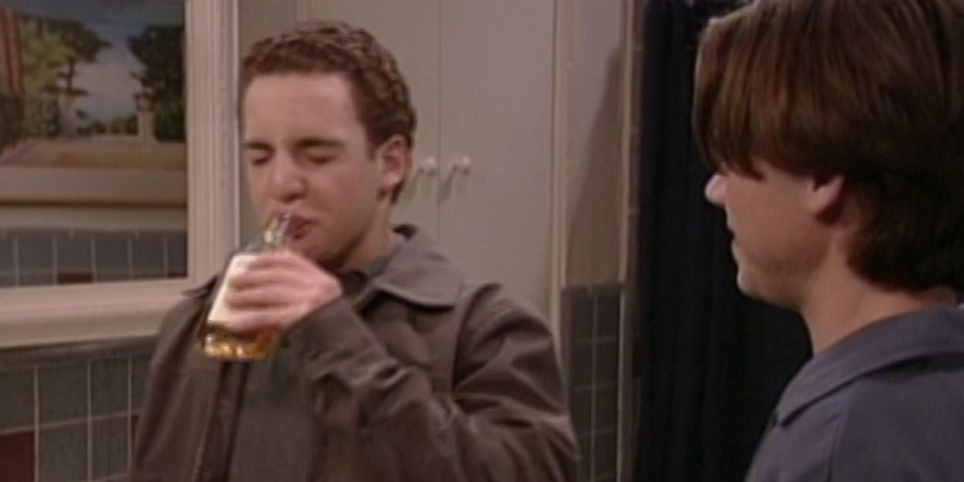 Cory (Ben Savage) drinking a bottle of whiskey with Shawn (Rider Strong) in Boy Meets World Season 5