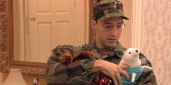 Still from 'Arrested Development': Buster Bluth (Tony Hale) wears an army uniform and holds stuffed toys.