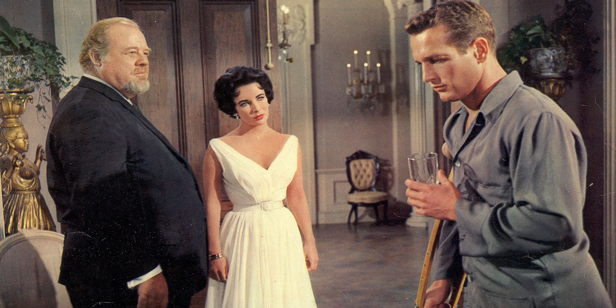 Elizabeth Taylor and Paul Newman as Maggie and Brick talking to Big Daddy in Cat on a Hot Tin Roof.