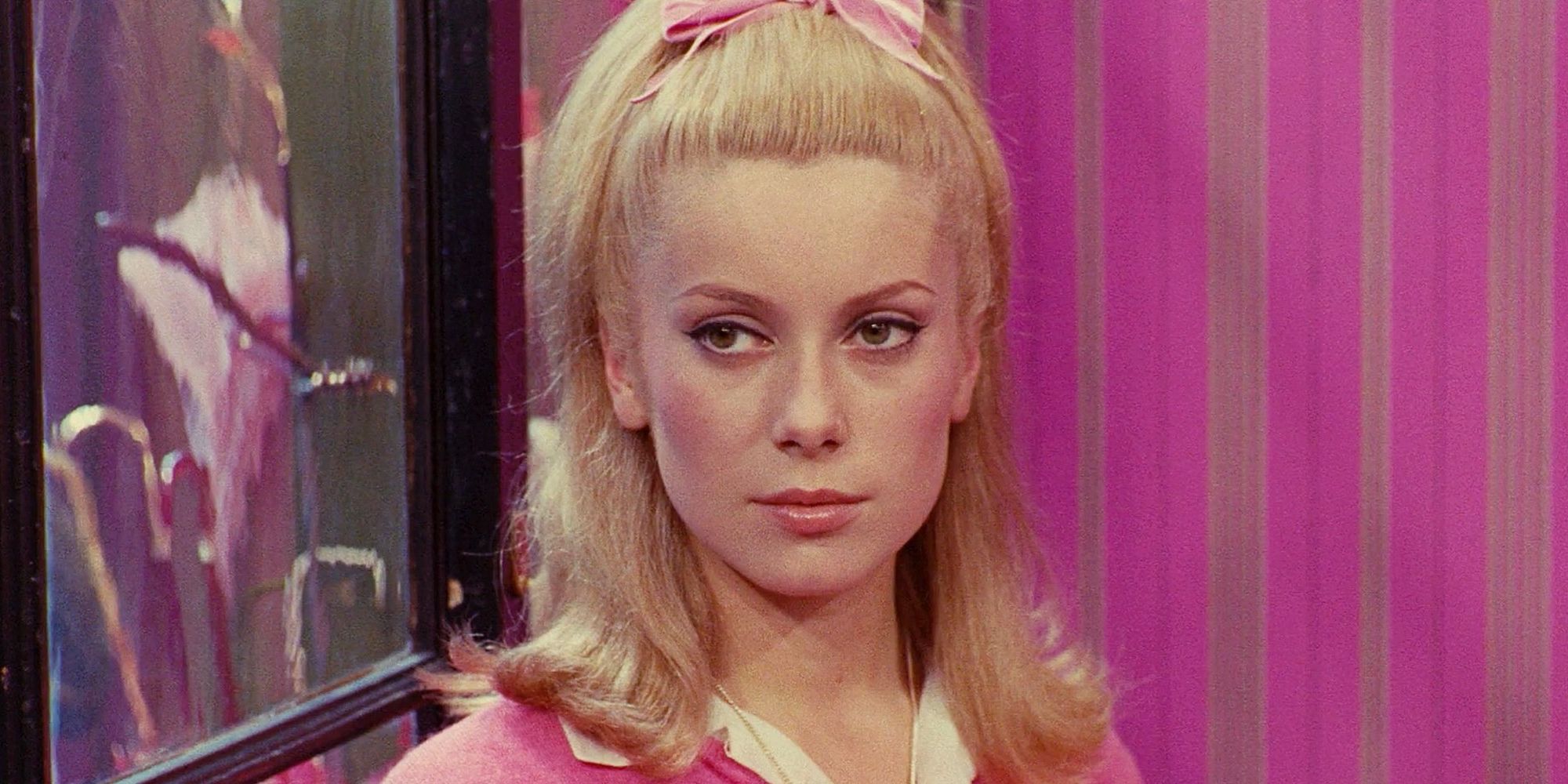 A close-up shot of Catherine Deneuve in The Umbrellas of Cherbourg