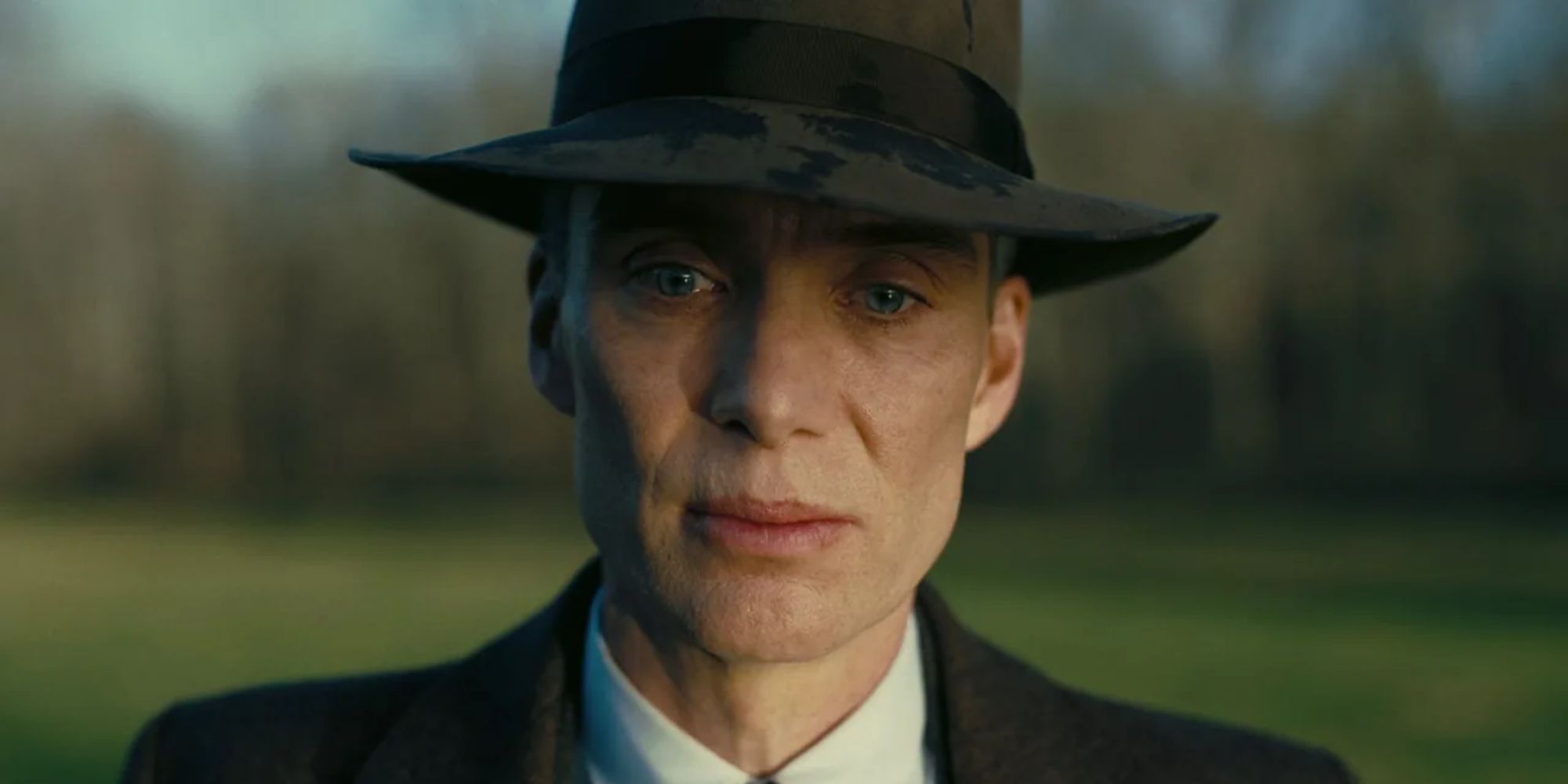 A close-up of Cillian Murphy as J. Robert Oppenheimer looking grim in Oppenheimer