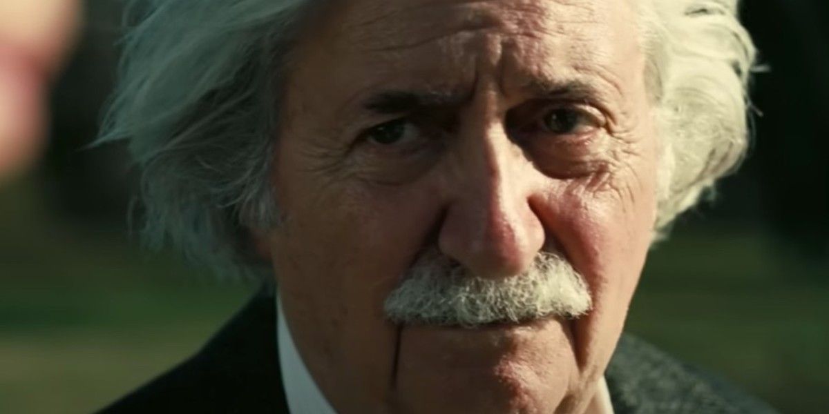 Bill Conti as Albert Einstein looking tired and disappointed in Oppenheimer 
