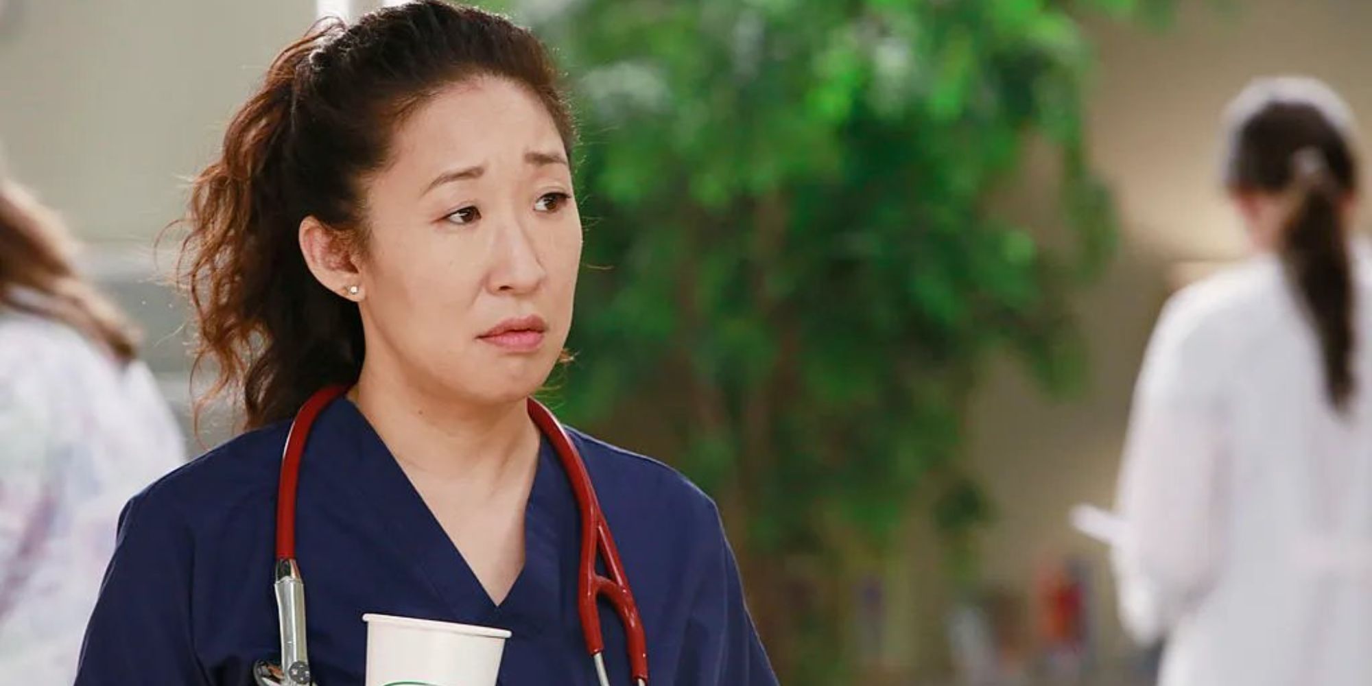 Sandra Oh as Cristina Yang, wearing a stethoscope and looking unimpressed on Grey's Anatomy