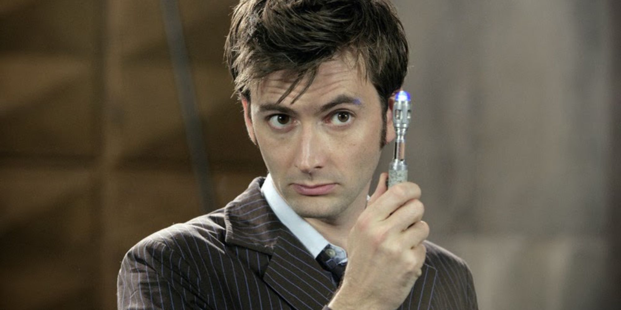 The Doctor holding his sonic screwdriver.