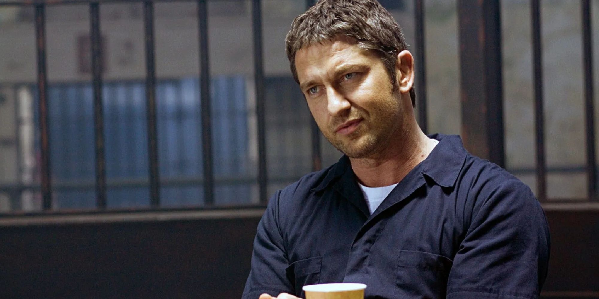 Gerard Butler as Clyde Shelton in prison looking seriously at something off-camera in Law Abiding Citizen