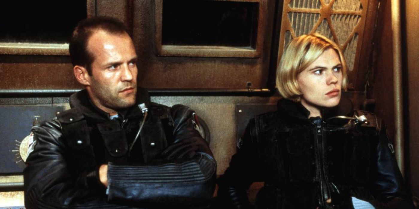 Jason Statham and Clea DuVall with arms crossed in Ghosts of Mars