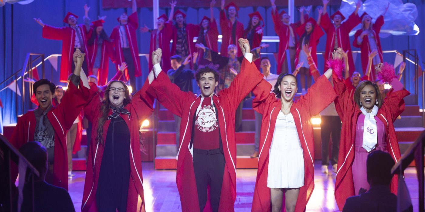 High School Musical The Series Season 4 cast cheering and wearing graduation robes