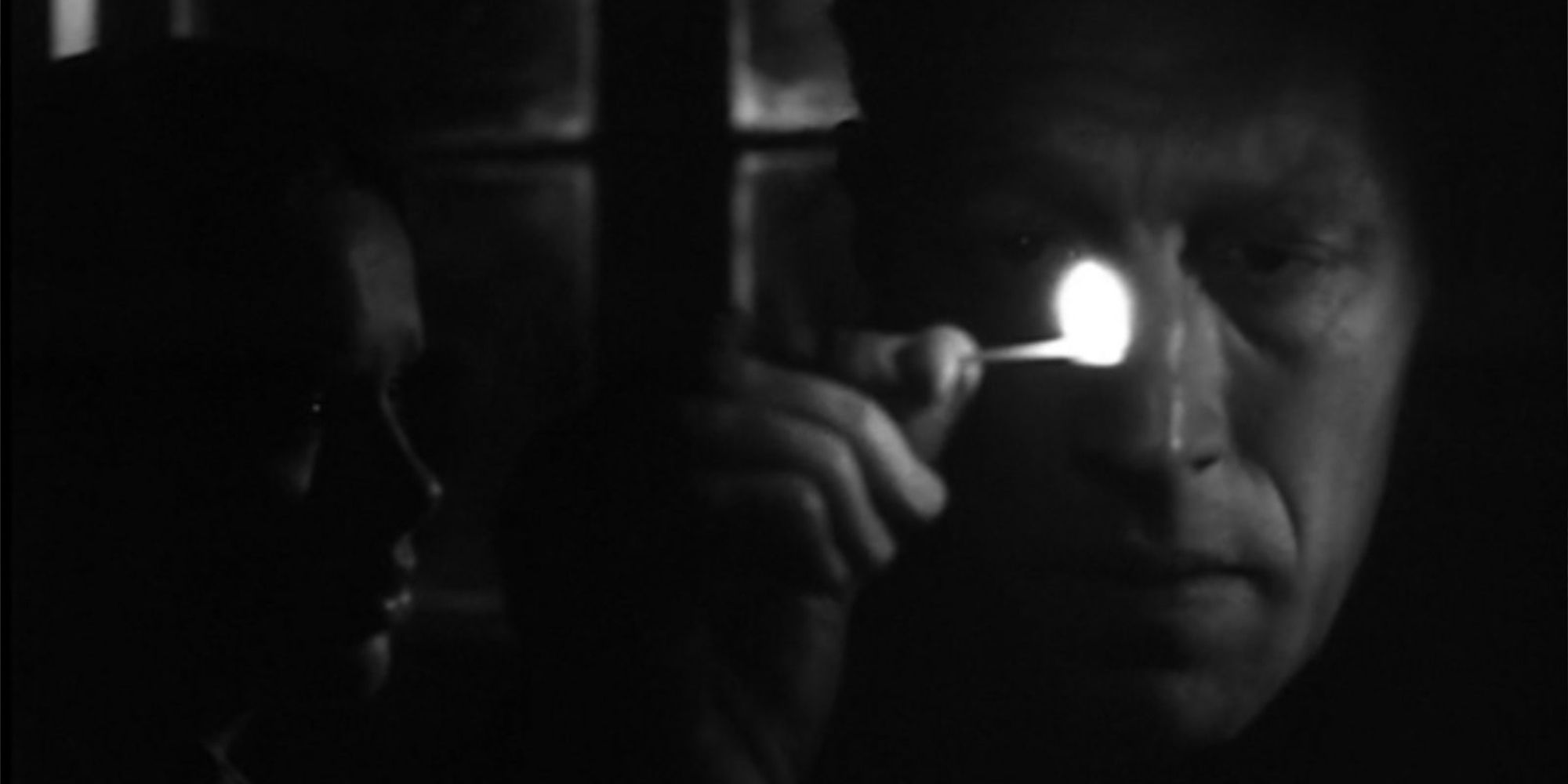 Max von Sydow as Johan holding a match in Hour of the Wolf