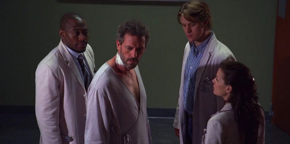 Omar Epps, Hugh Laurie, Jesse Spencer, and Jennifer Morrison as Foreman, House, Chase, and Cameron standing and looking worried 'House, M.D.