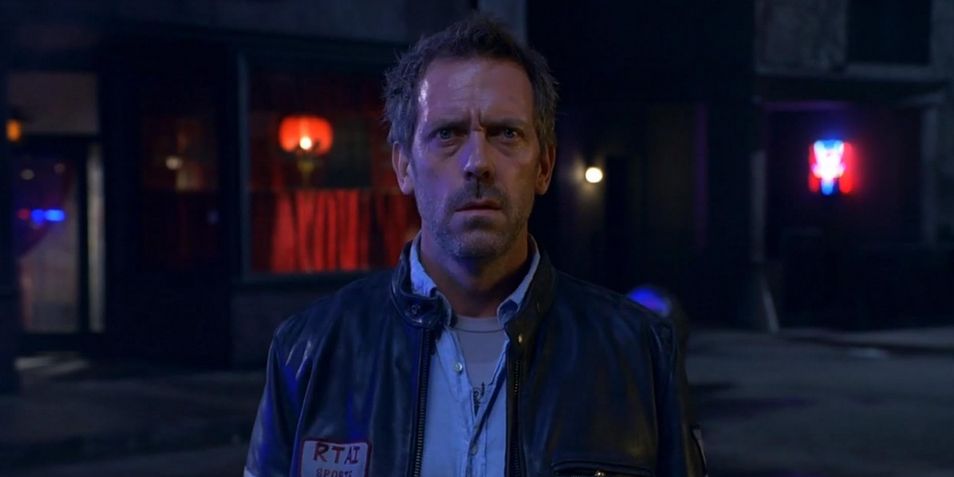 Hugh Laurie as Dr. Gregory House in 'House, M.D.', he is wearing a biker jacket and looking straigh ahead.