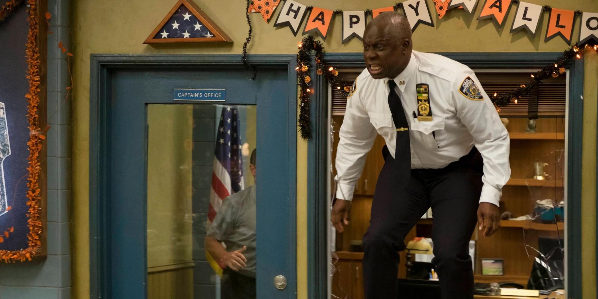 Holt from Brooklyn Nine-Nine standing on a desk