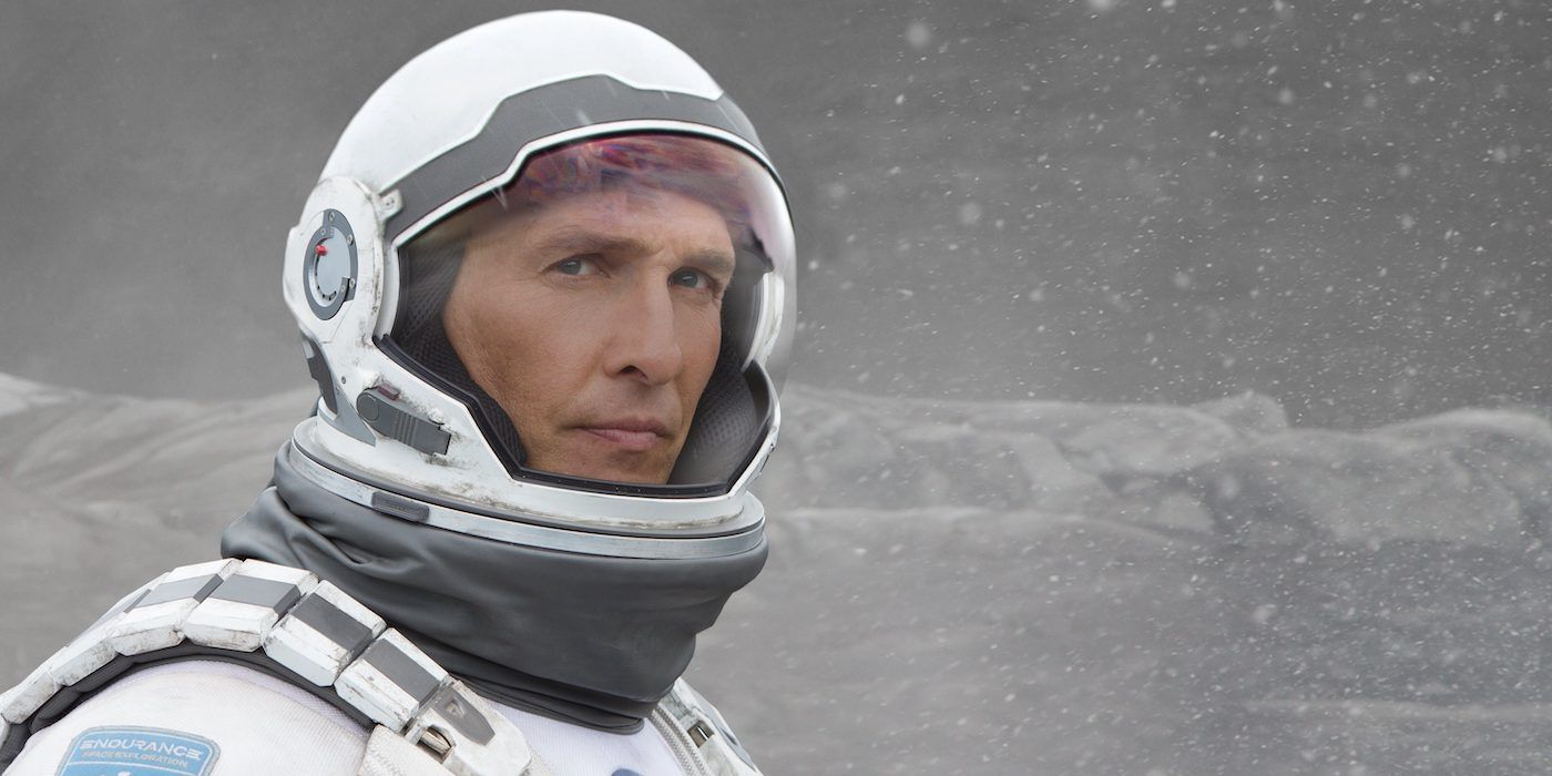 close up of Cooper (Matthew McConaughey) in a space suit on a snowy planet in Interstellar