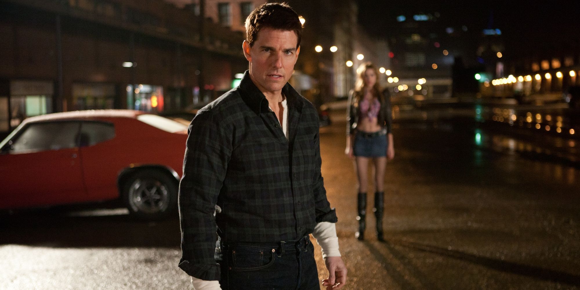 Tom Cruise as Jack Ryan, standing in the street at night in 2012's Jack Ryan