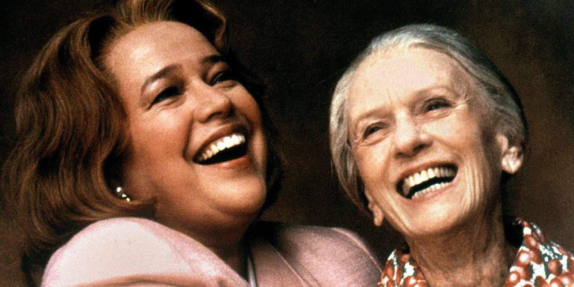 Jessica Tandy and Kathy Bates as Evelyn and Ninny laughing while holding each other in Fried Green Tomatoes