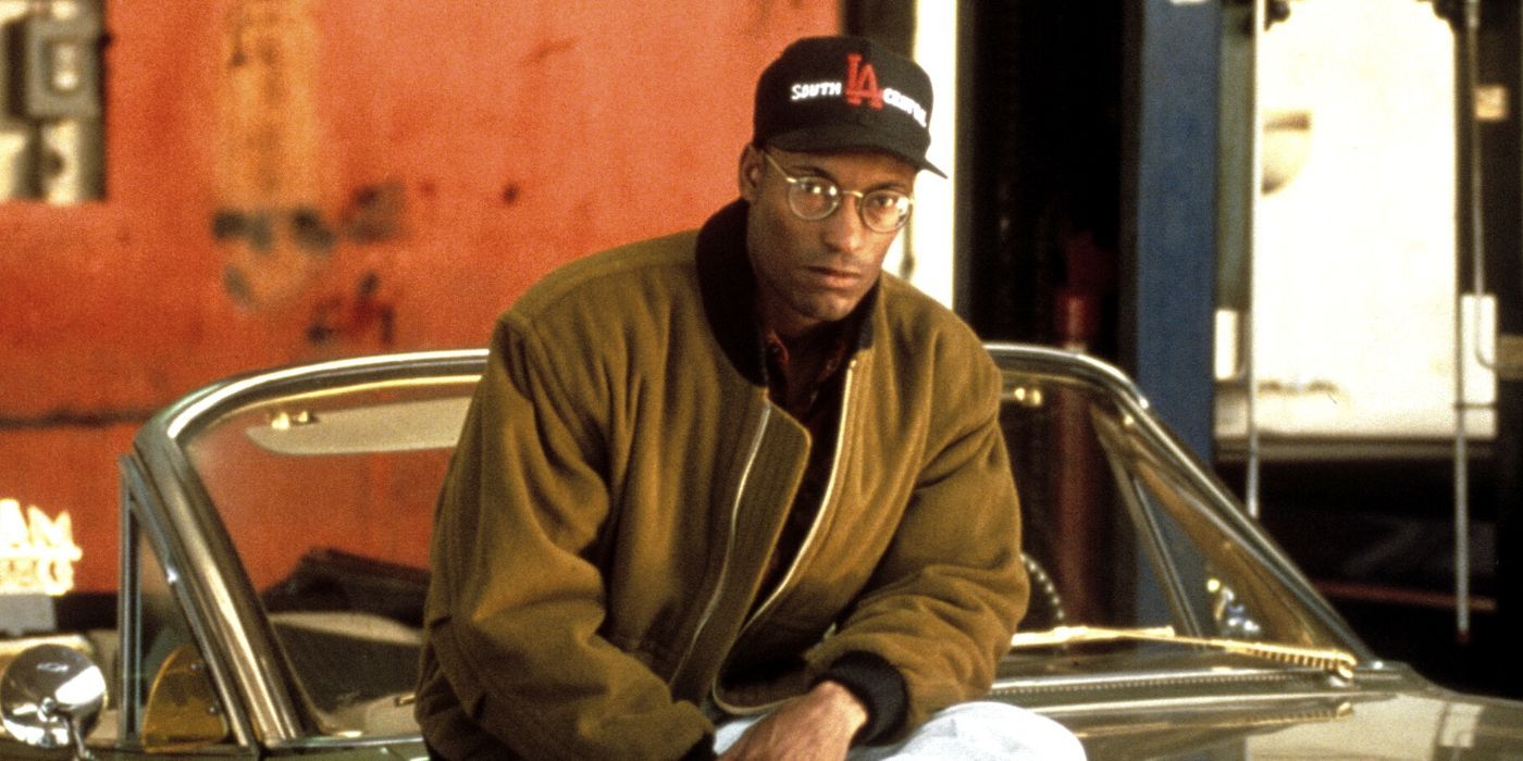 John Singleton sitting on the hood of a car for Boyz n the Hood