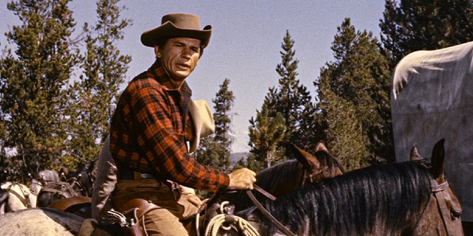 Charles Bronson as Red Haislipp riding a horse in the film Jubal - 1956