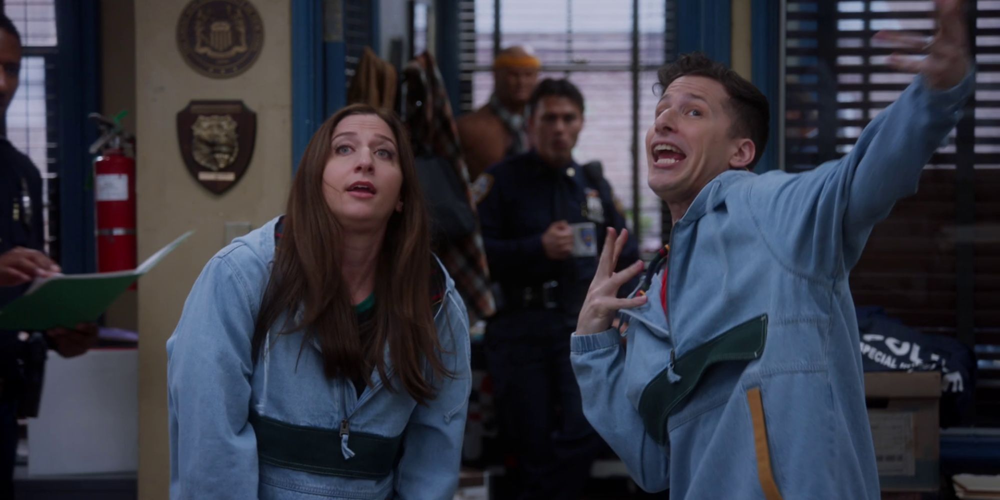 Jake and Gina from Brooklyn Nine-Nine standing together