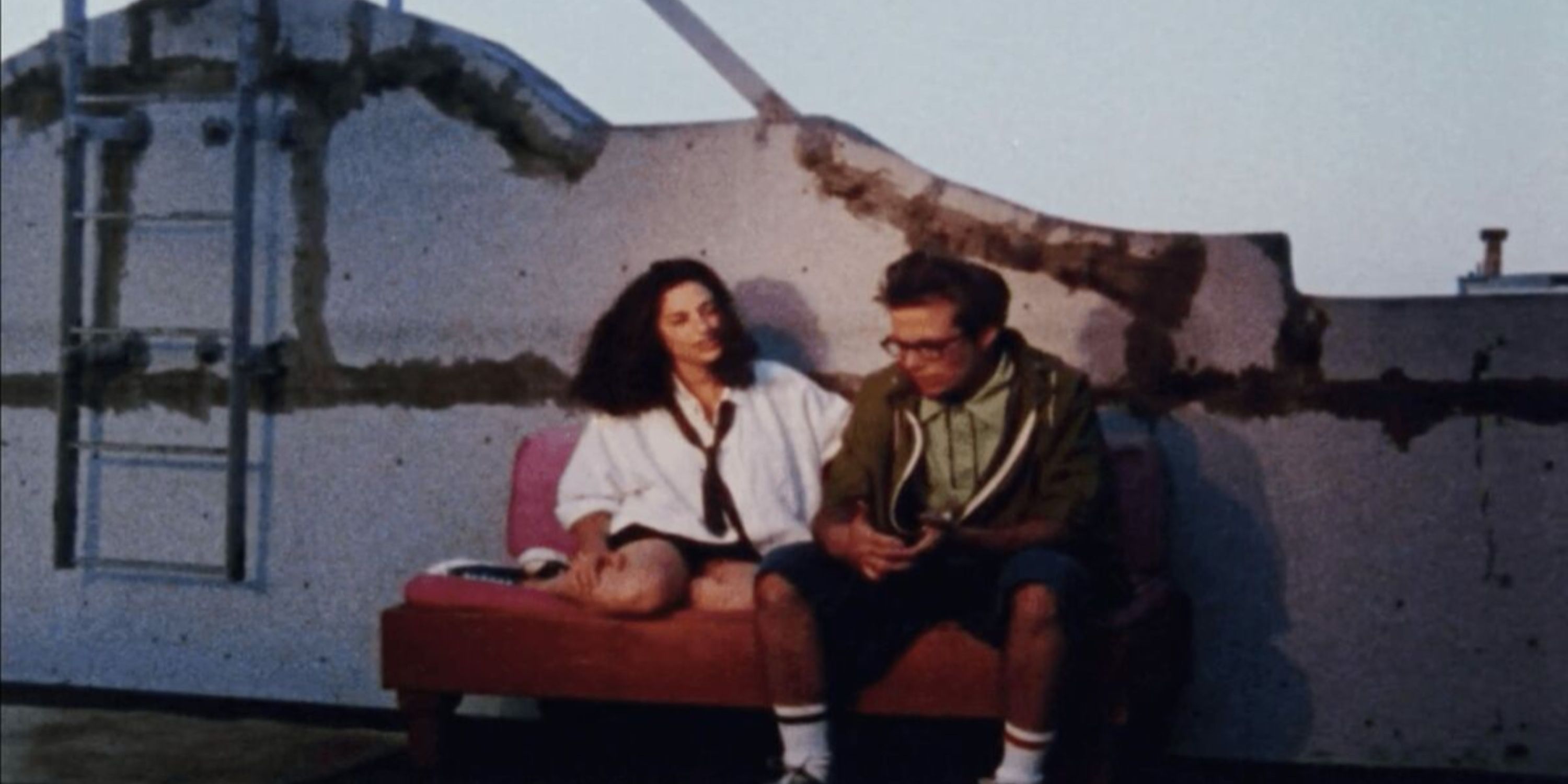A woman and a man sitting on a bench in Mary Jane&rsquo;s Not a Virgin Anymore