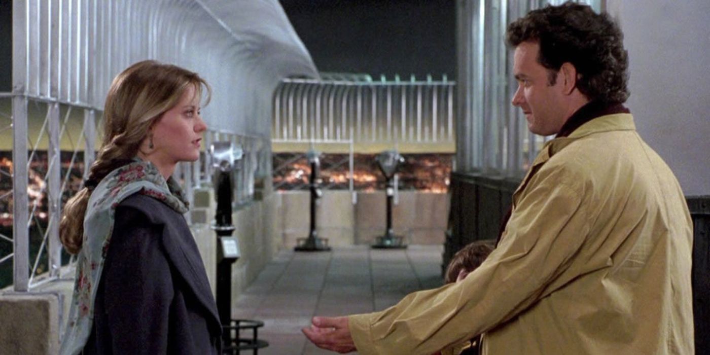 Meg Ryan standing in front of Tom Hanks in Sleepless in Seattle (1993)