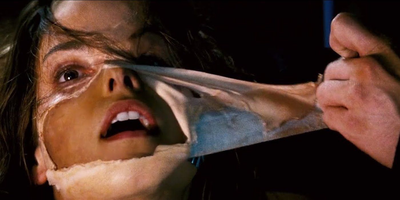 A woman pulling a mask off her face in Mission: Impossible III