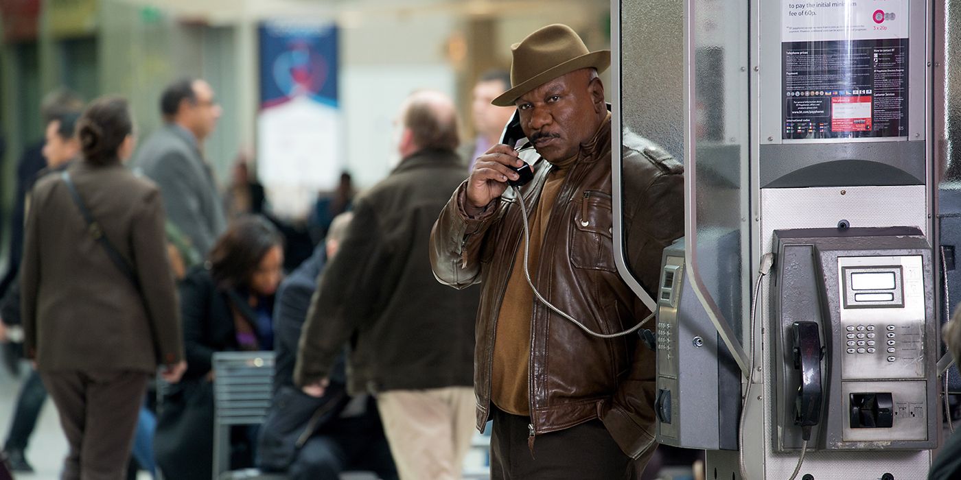 Luther Stickell using a phone booth in the Mission: Impossible franchise