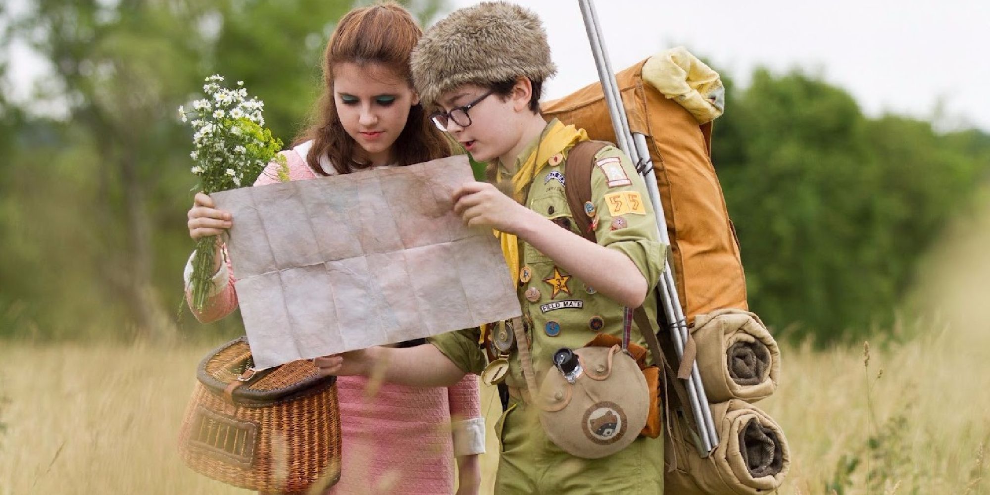 Sam and Suzy looking at a map in Moonrise Kingdom