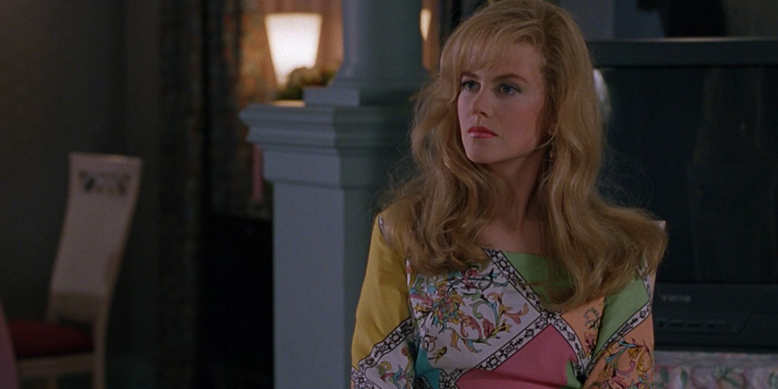 Nicole Kidman as Suzanne Stone, looking angry and wearing a colorful dress in To Die For