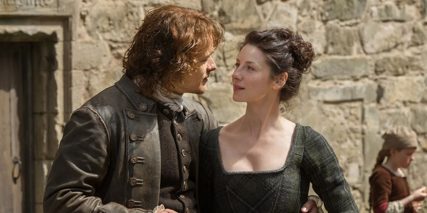 Jamie, played by Sam Heughan, holding Claire, played by Caitriona Balfe, in 'Outlander' Season 1, Episode 12.