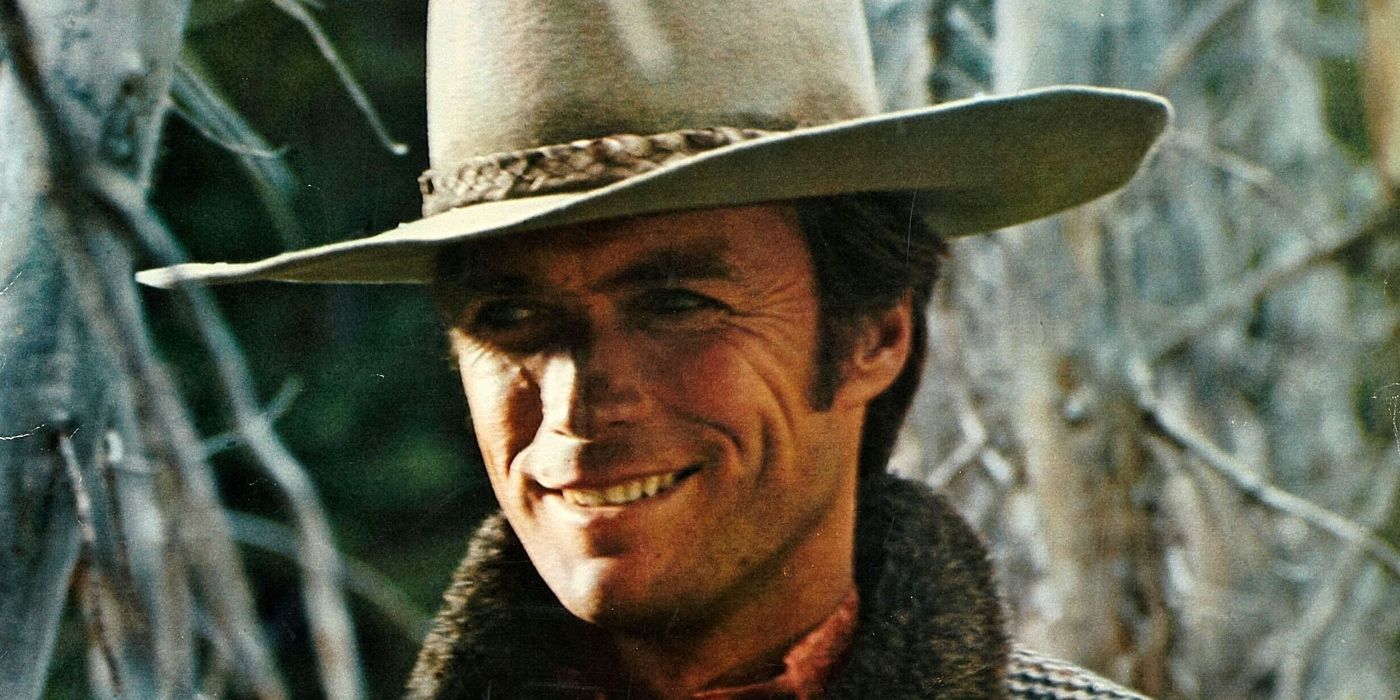 Clint Eastwood as Pardner looking at a person offscreen and smiling in Paint Your Wagon